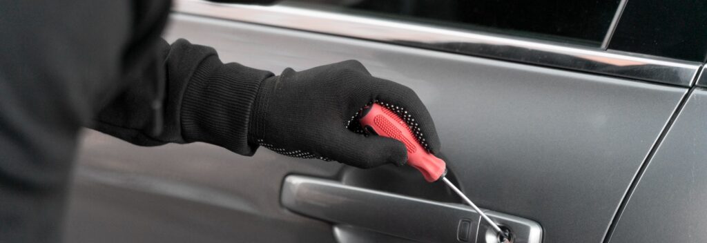 A car key being inserted into a well-maintained car lock