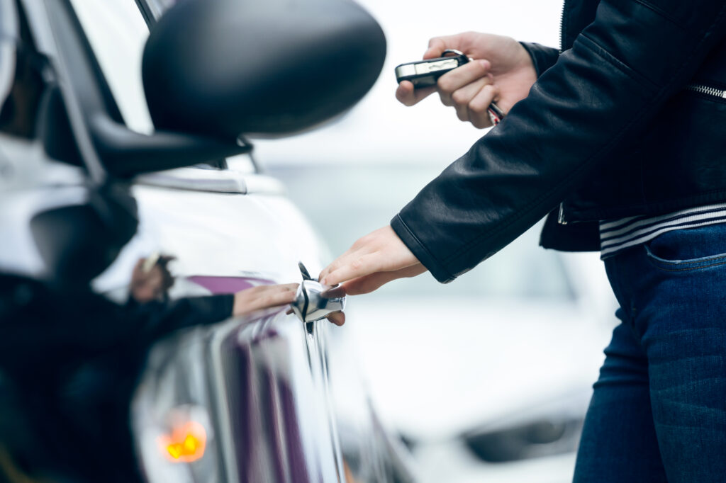 Car key fob with buttons for locking, unlocking, and starting a car