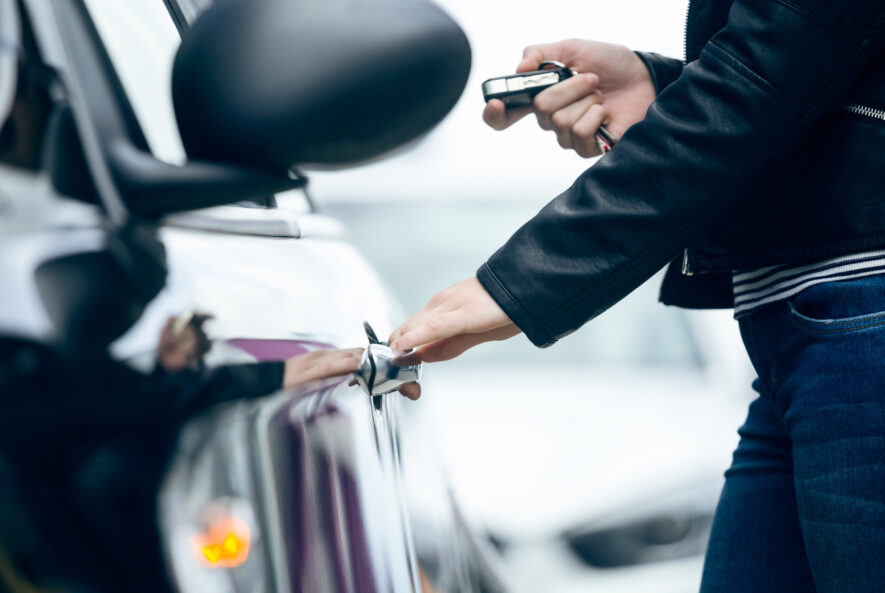 Car key fob with buttons for locking, unlocking, and starting a car