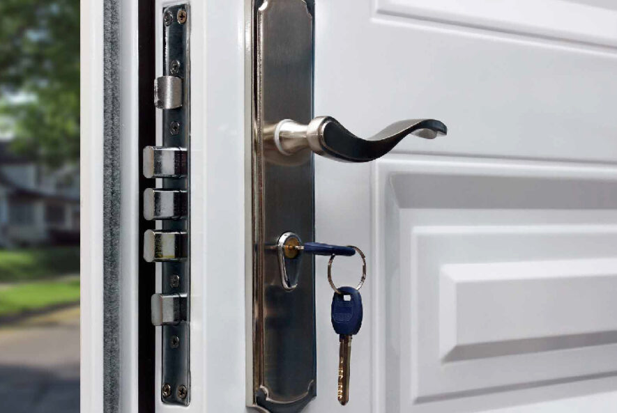 A professional locksmith inspecting a business lock to ensure security and prevent unauthorized access.