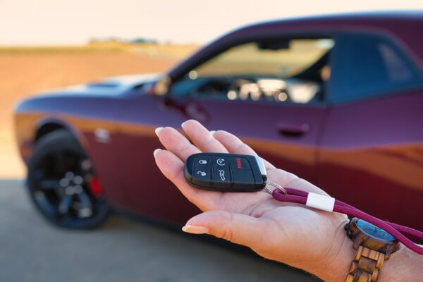 Car key fob with buttons for locking, unlocking, and starting a car