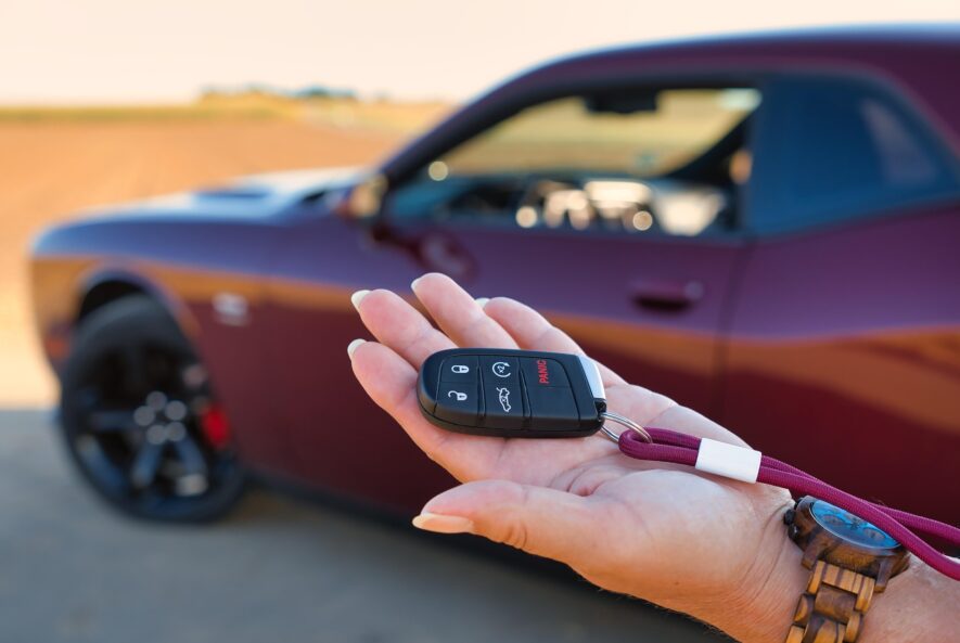 Car key fob with buttons for locking, unlocking, and starting a car